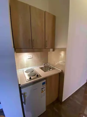 a small kitchen with a sink and a stove at Grand Residency Luksuzan stan u centru grada in Belgrade
