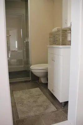 a bathroom with a toilet and a glass shower at Downtown Skadarlija in Belgrade