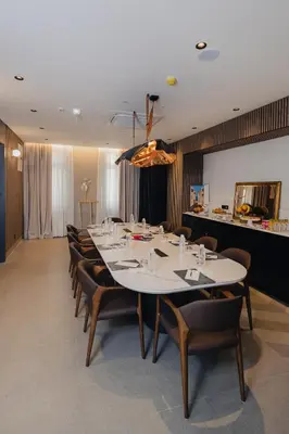 a large conference room with a long table and chairs at Hotel Flaneur in Belgrade