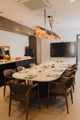 a conference room with a large table and chairs at Hotel Flaneur in Belgrade