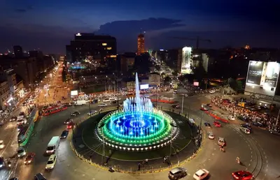 a large fountain in the middle of a city at night at Sunset apartment in Belgrade
