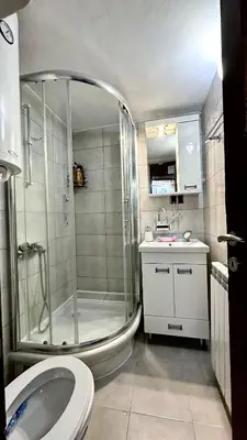 a bathroom with a shower and a sink and a toilet at Sunset apartment in Belgrade