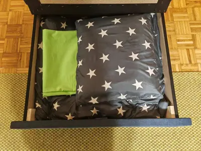 a bed with stars and a green pillow on it at NEW BELGRADE Lovely three bedroom apartment in Belgrade