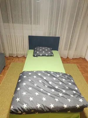 a bedroom with two beds with an american flag bedspread at NEW BELGRADE Lovely three bedroom apartment in Belgrade