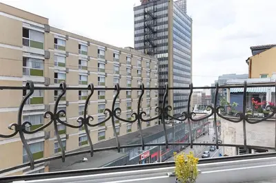 a balcony with a view of a city with buildings at Apartman Paradise Slavija Dos in Belgrade