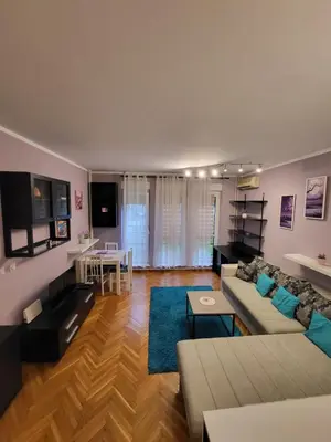 a living room with a couch and a table at Lucky Apartments New Belgrade in Belgrade