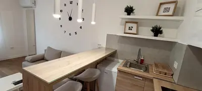 a kitchen with a counter and a sink in a room at Stela apartment in Belgrade