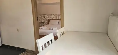a small room with two beds and a mirror at TeaBG in Belgrade