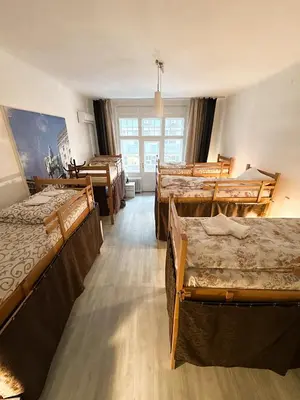a room with a bunch of beds in it at The Horse Monument Hostel in Belgrade