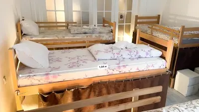 a room with three bunk beds in a room at The Horse Monument Hostel in Belgrade