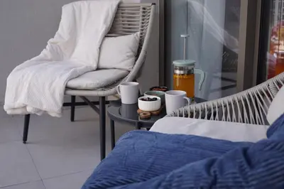 a room with a chair and a table with a bed at Belgrade Boutique Verde in Belgrade