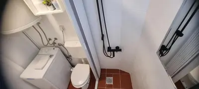 a small bathroom with a toilet and a sink at Mi Casita Studio in Belgrade