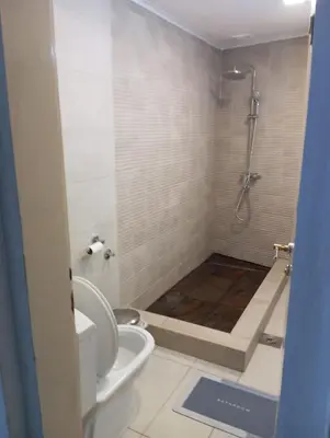 a bathroom with a shower and a toilet in it at Central market plaza Promo price ! in Belgrade