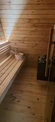 a sauna with a bench in a wooden room at Villa SS Black Fruška Gora in Čortanovci