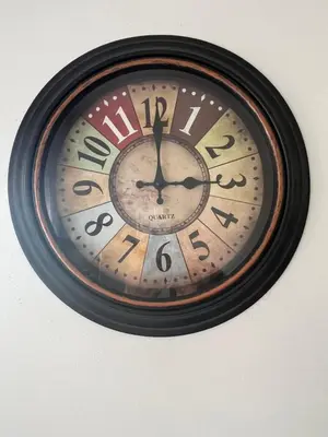 a clock is hanging on a wall at La Casa Stan na dan in Belgrade