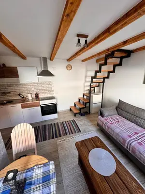 a living room with a couch and a table at Johnny Apartment in Belgrade