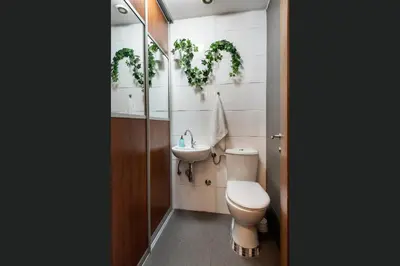 a bathroom with a toilet and a sink at Čubrina - central 2bdrm & 45m2 Rooftop Terrace in Belgrade
