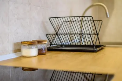 a counter with two glass jars on a table at Apartmani Sloboda in Belgrade
