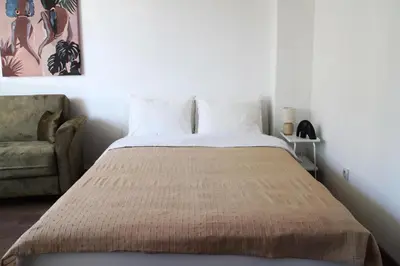 a bed in a room with a couch and a bed sidx sidx sidx at Gavrila Principa Apartment in Belgrade