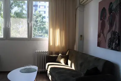 a living room with a couch and a table at Gavrila Principa Apartment in Belgrade