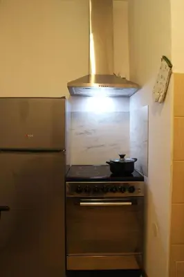 a kitchen with a stove with a pot on it at Gavrila Principa Apartment in Belgrade