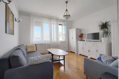 a living room with a couch and a table at Central apt Jovanova in Belgrade