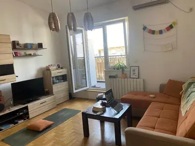 a living room with a couch and a table at Boba in Belgrade