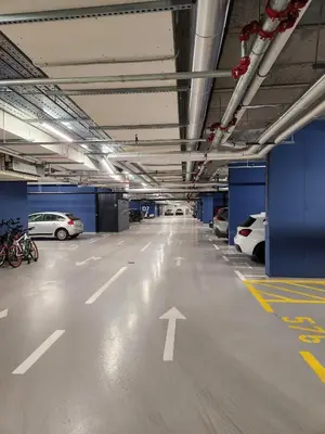 a large parking garage with cars parked in it at Novi Dorcol Big in Belgrade
