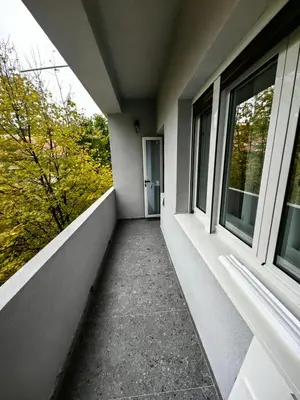 a balcony of a house with two windows at Apartman Cetkovic in Belgrade