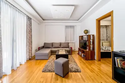 a living room with a couch and a tv at Apartment with balcony in Belgrade