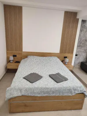 a bedroom with a bed with two pillows on it at Asja studio in Belgrade