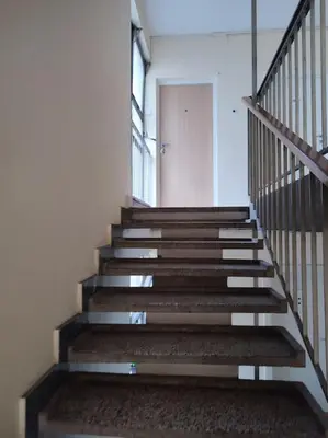 a set of stairs in a building with a door at Tesla apartment - lovely 2 bedroom apartment in Belgrade