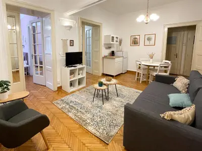 a living room with a couch and a table at Lukerly 1 in Belgrade