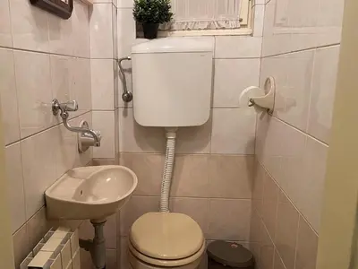 a small bathroom with a toilet and a sink at Lukerly 1 in Belgrade