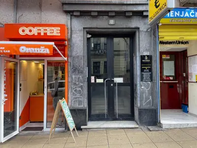 an entrance to a store with a sign in front of it at Lukerly 1 in Belgrade