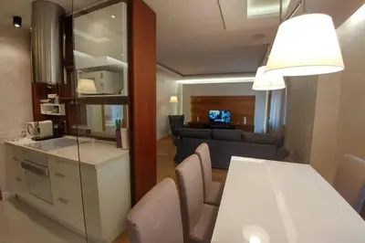 a living room with a white table and a couch at Belgrade Center Apartment Lux 2 in Belgrade
