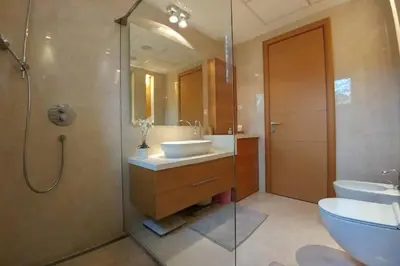 a bathroom with a sink and a shower and a toilet at Belgrade Center Apartment Lux 2 in Belgrade
