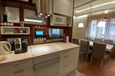 a kitchen with a counter top and a dining room at Belgrade Center Apartment Lux 2 in Belgrade