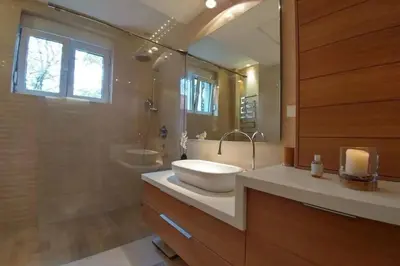 a large bathroom with a sink and a shower at Belgrade Center Apartment Lux 2 in Belgrade