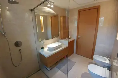 a bathroom with a sink and a toilet and a shower at Belgrade Center Apartment Lux 2 in Belgrade