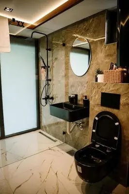 a bathroom with a black toilet and a sink at Riverhouse PIER in Beograd