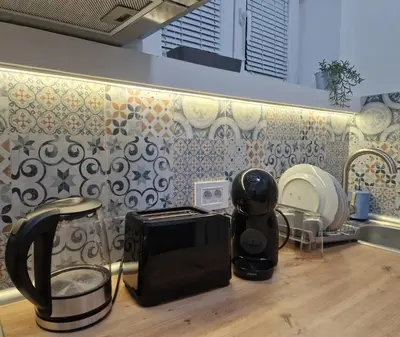 a kitchen counter with a toaster and a toaster and a toaster at Apartment Vera in Belgrade