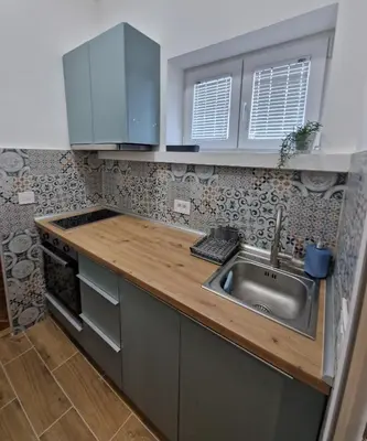 a kitchen with a sink and a counter top at Apartment Vera in Belgrade