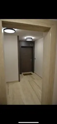 a hallway with a door in a room at Apartman Ilija in Belgrade