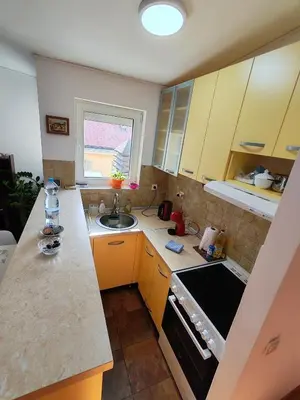 a small kitchen with a sink and a stove at Modern City Center Apartment - Rajiceva Loft in Belgrade