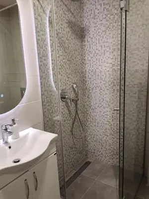 a bathroom with a shower and a sink at City011 studio PRIVATE GARAGE FREE in Belgrade