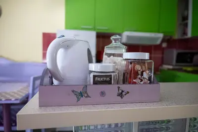 a purple box on top of a counter with jars at Apartman LAVANDA in Šumarak