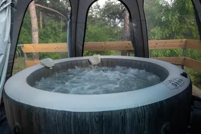 a hot tub in a tent with water in it at Apartman LAVANDA in Šumarak