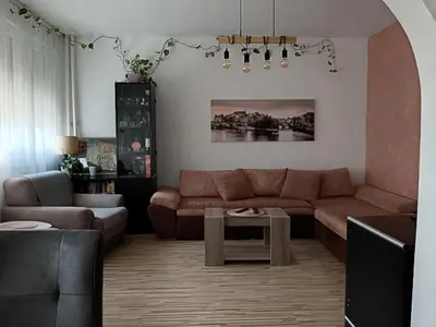 a living room with a couch and a table at Apartman Maki in Belgrade