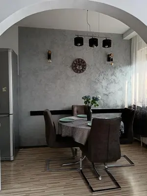 a dining room with a table and chairs at Apartman Maki in Belgrade